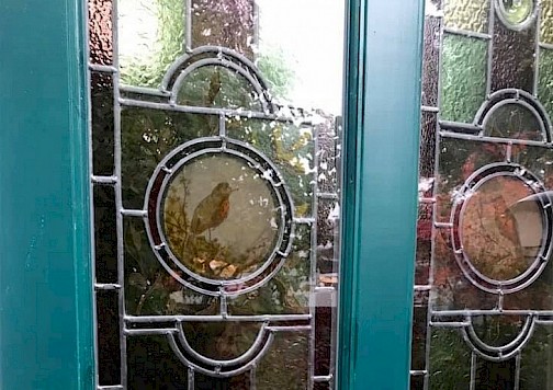 Robin stained glass window design